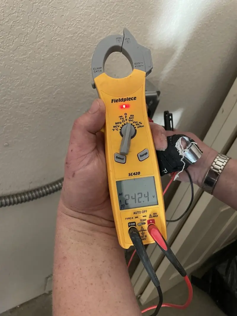 Voltage testing with clamp meter during Electrical Installation Services in Desert Palms